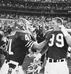 Pezman (left) and Kevin Labay celebrate UH’s win over A&M at the Astrodome in 1990. Photo by Dale Toney. Image courtesy UH Libraries Digital Collection.